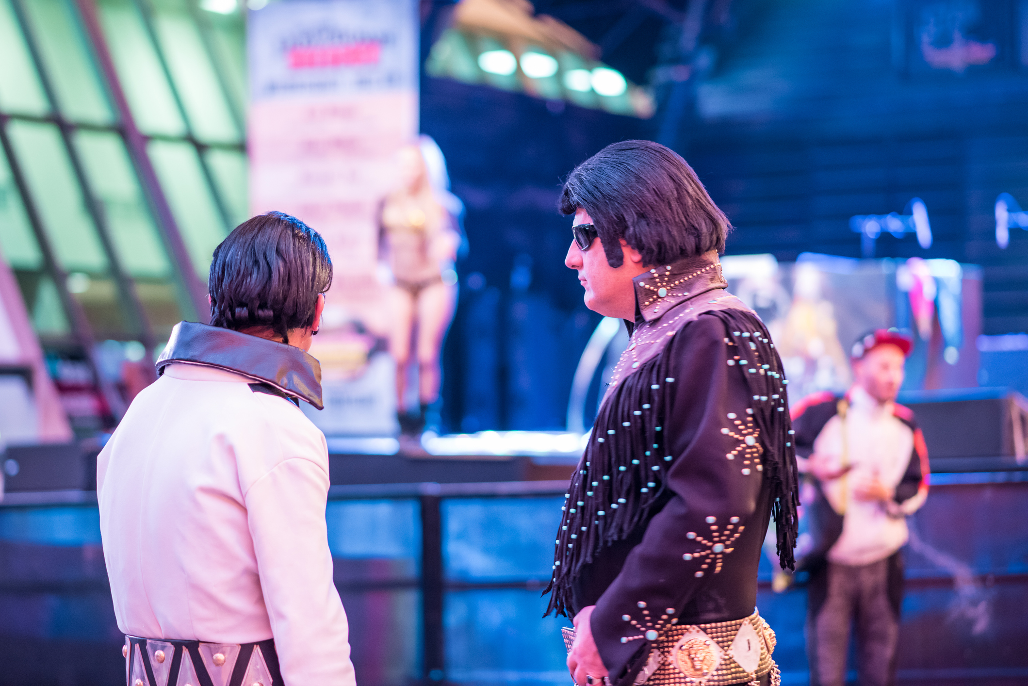Las Vegas, Nevada, November 24, 2017: Two Elvis impersonators hanging out at the historic Fremont Street Experience, downtown Las Vegas. Las Vegas attracts millions of visitors yearly.