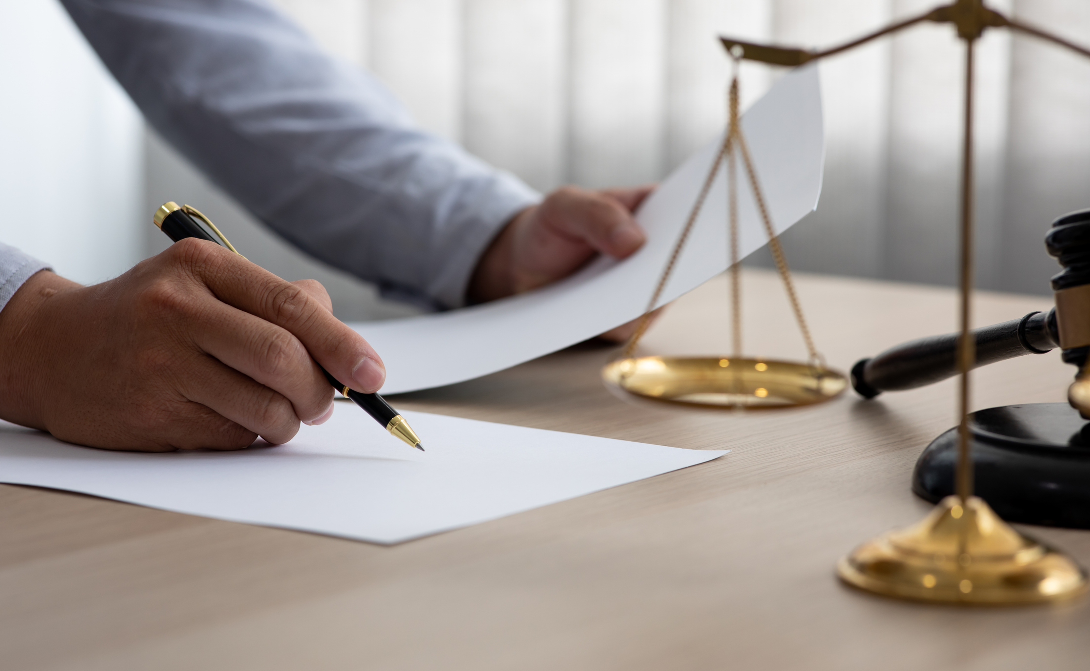 Male Judge working Document At Desk,Legal law, advice and justice concept.