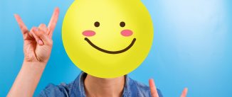 Unrecognizable woman with happy smiley instead of face